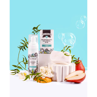 Rinse-free deodorizing shampoo for pets, 3-piece set with white bottle, bar, and box on turquoise backdrop