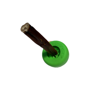 Green circular Dapper grip wheel, small size, with a brown wooden dowel inserted through the center.