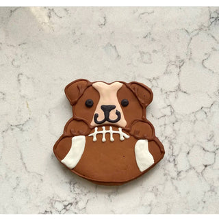 Sports Ball Buffet Cookies: dog-shaped cookie in brown icing with a football motif and white laces