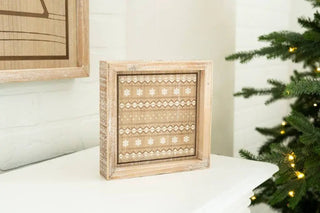 Wood frame sign 7x7 inches with rustic beige pattern, displayed on a white table beside a Christmas tree.