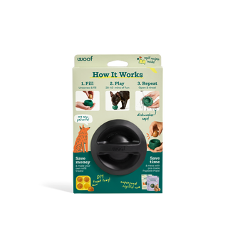 Power Chewer Pupsicle dog treat-dispensing toy on packaging; black round dispenser with green accent.