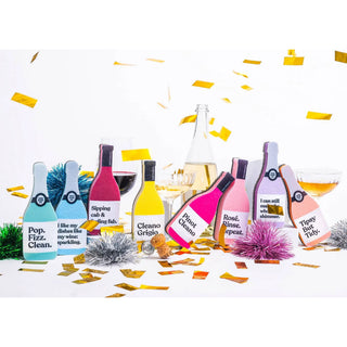 Scrubbly Sponge Tipsy bottle-shaped sponges in pastel colors with gold confetti.