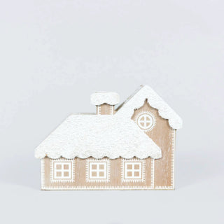 7x5 house-shaped wooden ornament with snowy roof and white geometric windows.