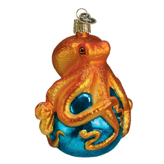 Octopus ornament in orange and gold with blue base, glitter accents, holiday decor.
