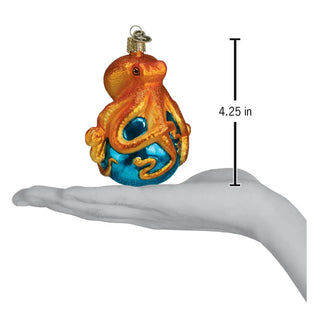 Octopus ornament, orange glitter with turquoise-blue base, 4.25 in tall.