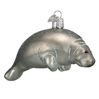 Manatee ornament, silver-toned with glitter accents and hanging loop.