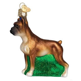Boxer ornament with glittery brown coat on a green glitter base, gold-tone top, and a heart charm.