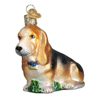 Basset Hound ornament; golden-tan and black dog with glitter accents on a green base