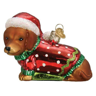 Dashing Dachshund Puppy Ornament in red Santa coat with green scarf and white polka dots.