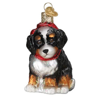 Bernedoodle puppy ornament with black, white and tan coat, red scarf and glitter accents