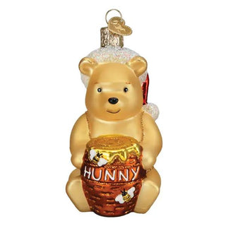 Pooh ornament, gold-tone glass figure holding a honey pot labeled Hunny with glitter cap