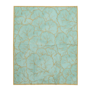 Guest towel napkin in turquoise with gilded gold botanical pattern and border.