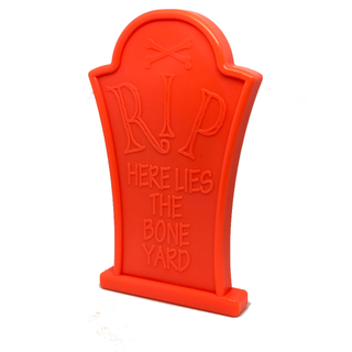 Orange nylon headstone dog chew toy with RIP here lies the bone yard design