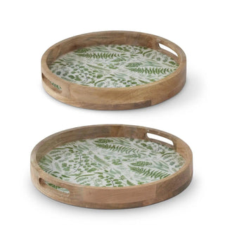 Two round wood trays with enameled fern-pattern interiors; natural wood frames with built-in handle cutouts.