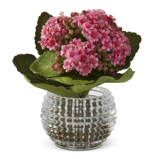 Pink kalanchoe arrangement in a pressed glass vase.