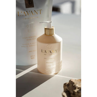 Ambre Santal dish soap bottle with white pump, beige matte finish and gold collar.