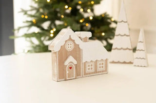 Wooden house-shaped Christmas ornament, 7x5 inches, beige with white snow and a red heart on the door