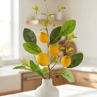 Lemon and Foliage Stem 28in artificial flora with four yellow lemons and green leaves in a white vase.