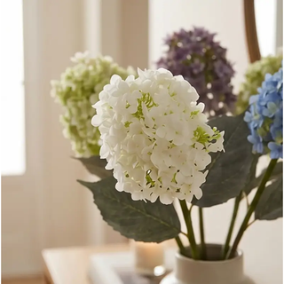 Cone Hydrangea Stem, white artificial flowering plant in vase with green leaves