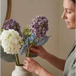 Cone hydrangea stems in vase with white, purple, and blue artificial blooms (4 stems)