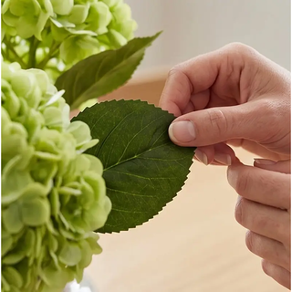 Real Touch Hydrangea Spray, green artificial hydrangea blooms with a leafy stem.