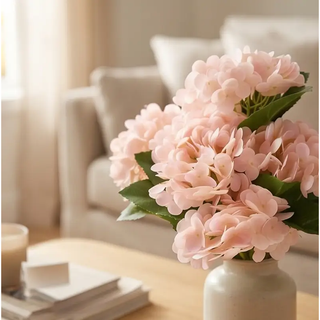 Light Peach Real Touch Hydrangea Bundle (6 stems) artificial flowers in a white ceramic vase on a wooden coffee table