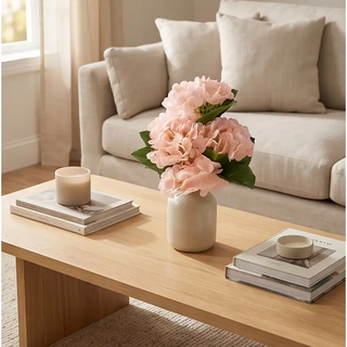 Light Peach Real Touch Hydrangea bouquet (6 stems) in a ceramic vase on a wooden coffee table