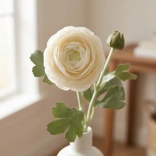Real Touch Bud & Bloom Ranunculus artificial flower with ivory petals and green leaves in a white vase