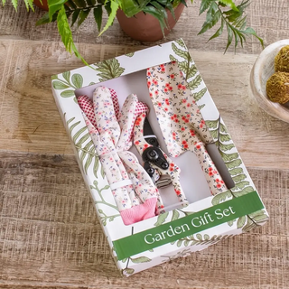 Gardening Gift Set with floral red fabric-wrapped tools in a white box with green botanical print