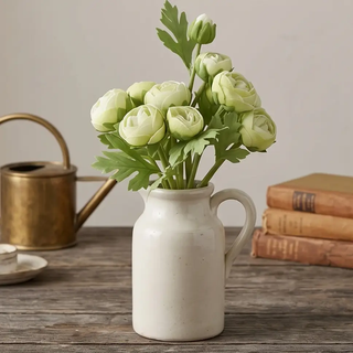 Real Touch Ranunculus Bundle, 10 stems, pale green blooms in a white ceramic pitcher.