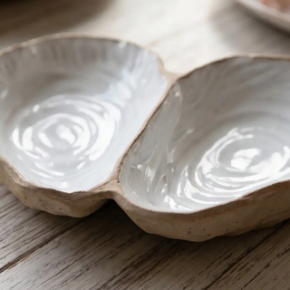 Stoneware oyster-shell dip dish, double-section with white glaze.