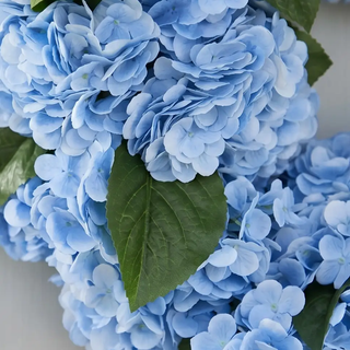 Blue real-touch hydrangea wreath with green leaves