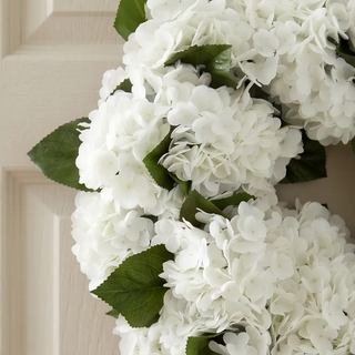 White Real Touch Hydrangea Wreath with lifelike blooms and green leaves