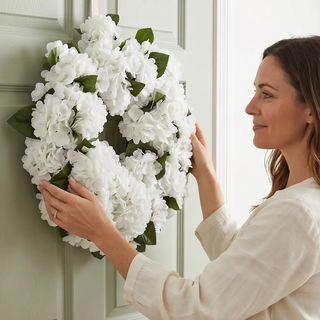 White real-touch hydrangea wreath on a green front door
