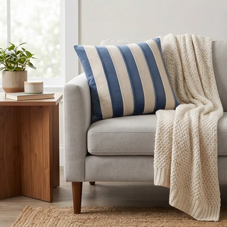 Blue Velvet & Natural Cotton Striped Square Pillow on a light gray sofa