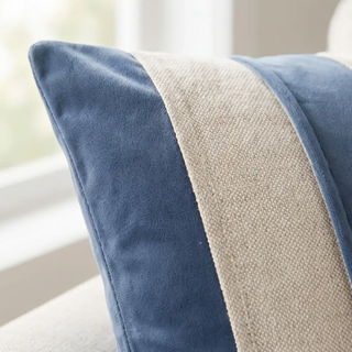 Blue velvet square pillow with a natural cotton beige striped center panel