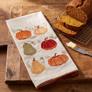 Autumn Pumpkin Dish Towel, cream fabric with embroidered pumpkins and burnt-orange trim.