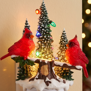 Animated Swirling Glitter Cardinal Night Light featuring two red cardinals perched on a snowy log with colorful lights.