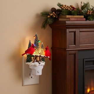 Animated Swirling Glitter Cardinal Night Light with two red cardinals perched among snowy trees on a white plug-in base