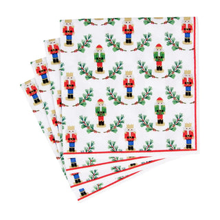 Cocktail napkins set of 4, Little Nutcracker design, Caspari, white with nutcracker motif and green pine sprigs
