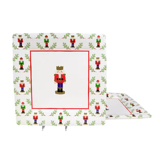 Pair of Little Nutcracker Square dinner plates with nutcracker imagery and festive red border at the center