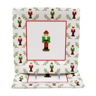 Square Little Nutcracker salad/dessert plates set of 2 with white background, red frame and nutcracker motifs.
