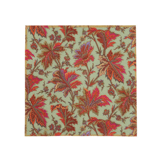 Cocktail napkin with sage green background and vivid paisley leaf motif in red, orange, and purple.