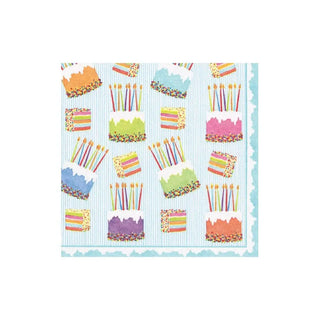 Cocktail napkin paper linen with colorful cake frosting pattern on blue striped background