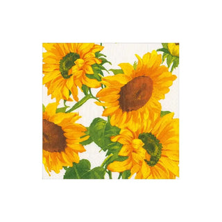 Cocktail napkin with sunflower field print in yellow and green on white background.
