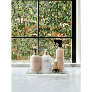 Multipurpose Cleaner Blushed Bergamot bottles set, four peach-toned dispensers with pumps and a spray on a clear tray.