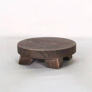 Mini round espresso wood riser with short angled legs for tabletop decor