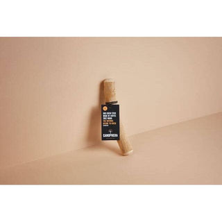 Dog chew stick made of coffee wood, natural finish.