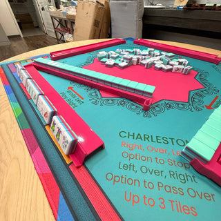 Lunaflor Mahjong Mat on teal playing surface with pink rails and pastel Mahjong tiles.