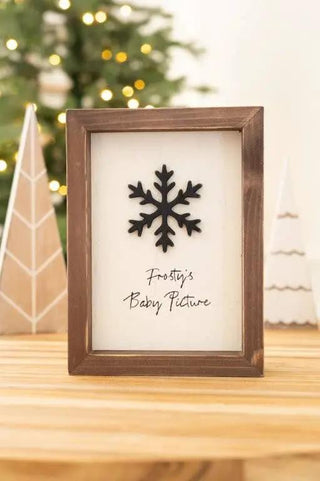Wood frame sign 6x8 in, brown finish with white background, black snowflake motif and Frosty’s Baby Picture text.